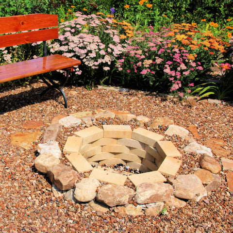 Fire pit stones and bricks used for a DIY in ground fire pit