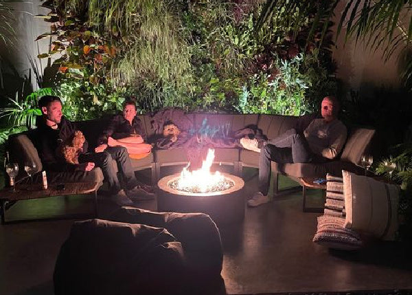 Fireplace | Planika Galio Star with Remote with a family sitting around