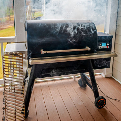Pellet Smoker in use on deck showing smoke billowing out
