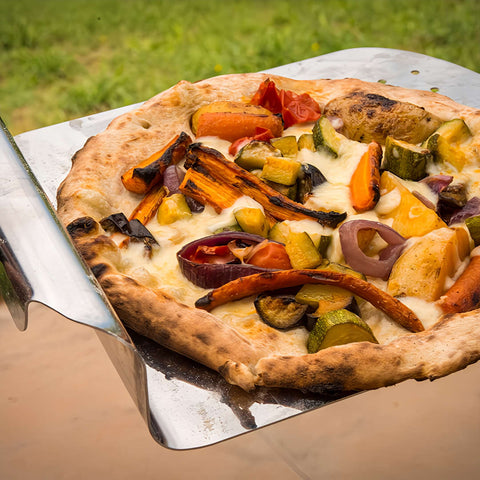 Perfectly cooked pizza done in a wood fired pizza oven