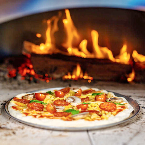 perfectly cooked pizza in pizza oven