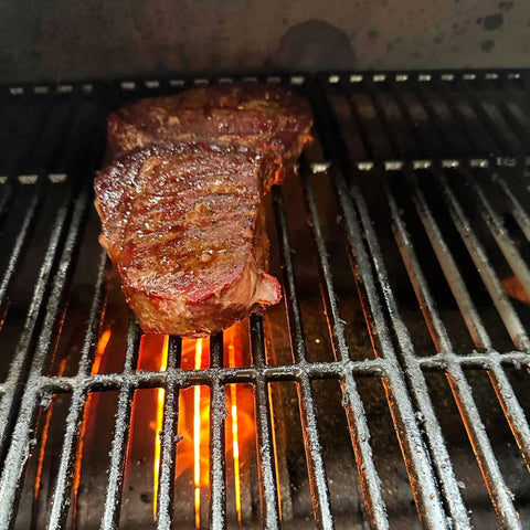 Best Reverse Seared Rib Fillet Steak | close up view of rib fillet steak finished the smoking process and now onto the open flames for a perfect sear
