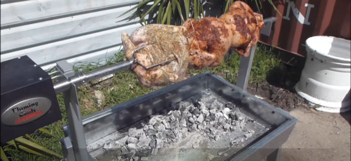 Extendable BBQ Spit Roaster  with chickens cooking