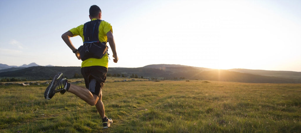 Man running outside in wide open field