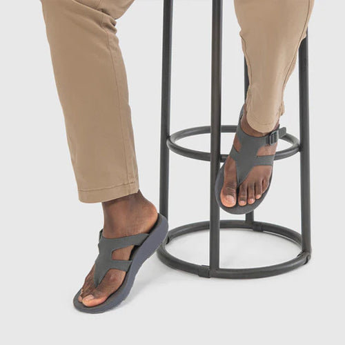 man sitting on a chair wearing Tread Labs mens Albion sandals