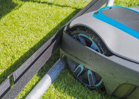 Secure mower shield attached to trampoline legs with Robostop technology.