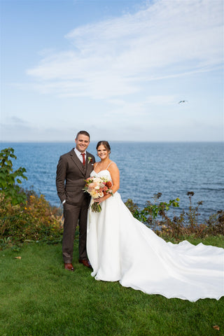 Image of bride and groom by cliffwalk in Newport, RI.