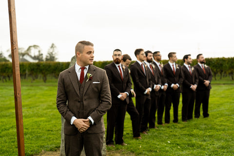 Image of groom and groomsmen awaiting bride to come down the aisle