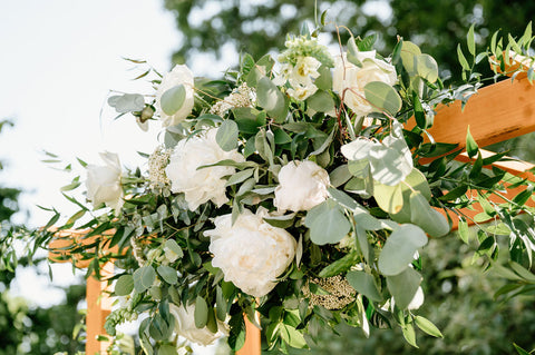 Summer Wedding at the Herb Lyceum - wedding arbor with beautiful white flowers and greenery