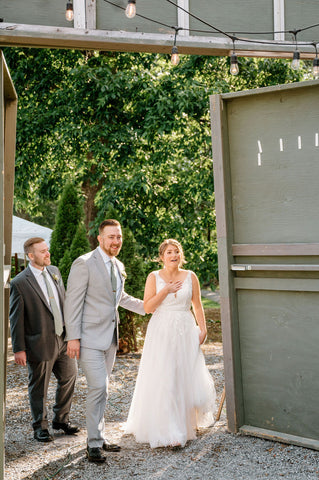 Summer wedding at the Herb Lyceum in Groton - couple walking into reception