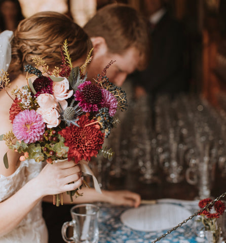 Fall bridal bouquet with dahlias, chysanthemum, berries, eucalyptus, roses