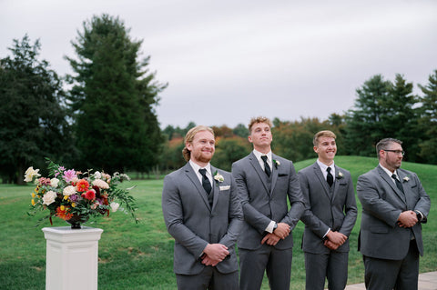 Image of groom and grommsmen at outdoor ceremony at the Cape Club of Sharon.