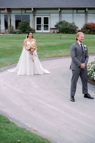 Image of bride and groom waiting for first look.