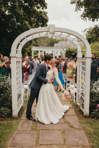 bride and groom at the Harding Allen Estate wedding in cetnral, MA - Peonies, gerberas, snapdragons, poppies, roses, ranunculus, chamomile, delphinium, craspedia, alstroemeria, hypericum, solidago, roses, stock, larkspur, wildflowers 