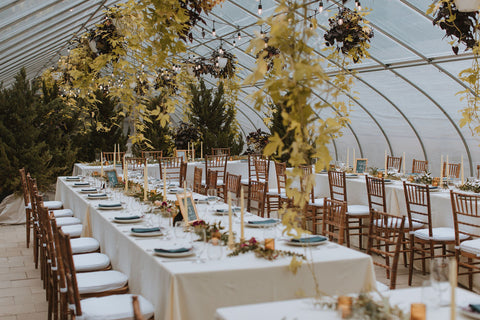 wedding reception at the Herb Lyceum greenhouse in Groton, MA. New England wedding reception. Versatile space. Wedding reception is designed with clean, simple beauty.