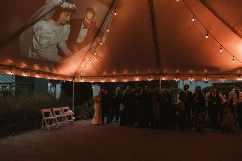 Wedding at the Herb Lyceum. Reception tent with photos projected during dancing.