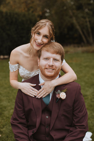 wedding couples portrait highlighting groom's boutonniere