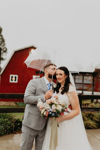 Image of Bride & Groom on their Wedding Day in front of the Westfield River Brewing Company red barn