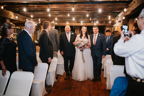 Image of bride walking down the aisle at her wedding ceremony at the Westfield River Brewing Company.