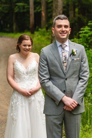 summer camp theme wedding couple's first look