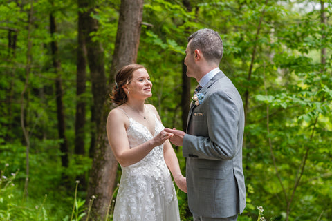 summer camp theme wedding couple's first look