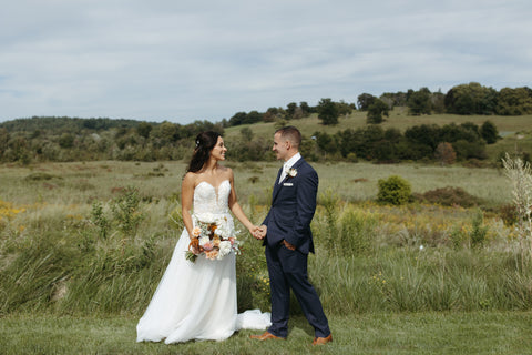 Wedding couple portraits late summer floral bouquet with timeless flowers and modern foliage including roses, dahlias, delphinium, dyed grevillea, rice flower, cress, and thistle