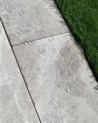 Water beading up on travertine deck