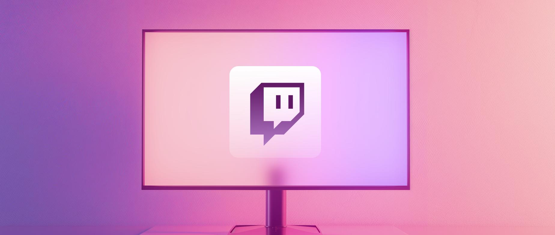 Monitor s ikonou společnosti Twitch na fialovém pozadí s přechodem barev.