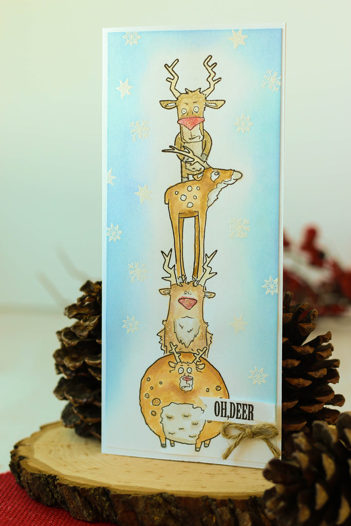 Brutus Monroe's reindeer stamps on this long and skinny card! Lots of masking and coloring went into creating this fun Christmas scene!