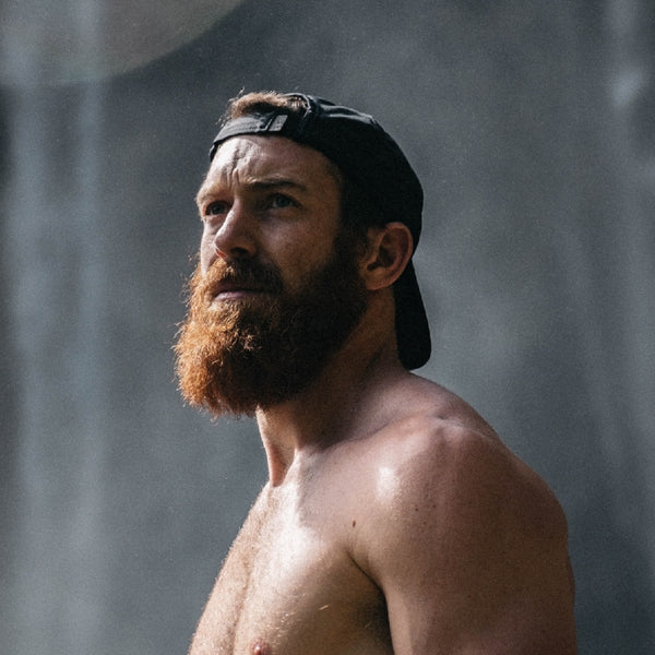 man with hat on with long beard 