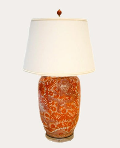 Orange lamp with white shade and acrylic base