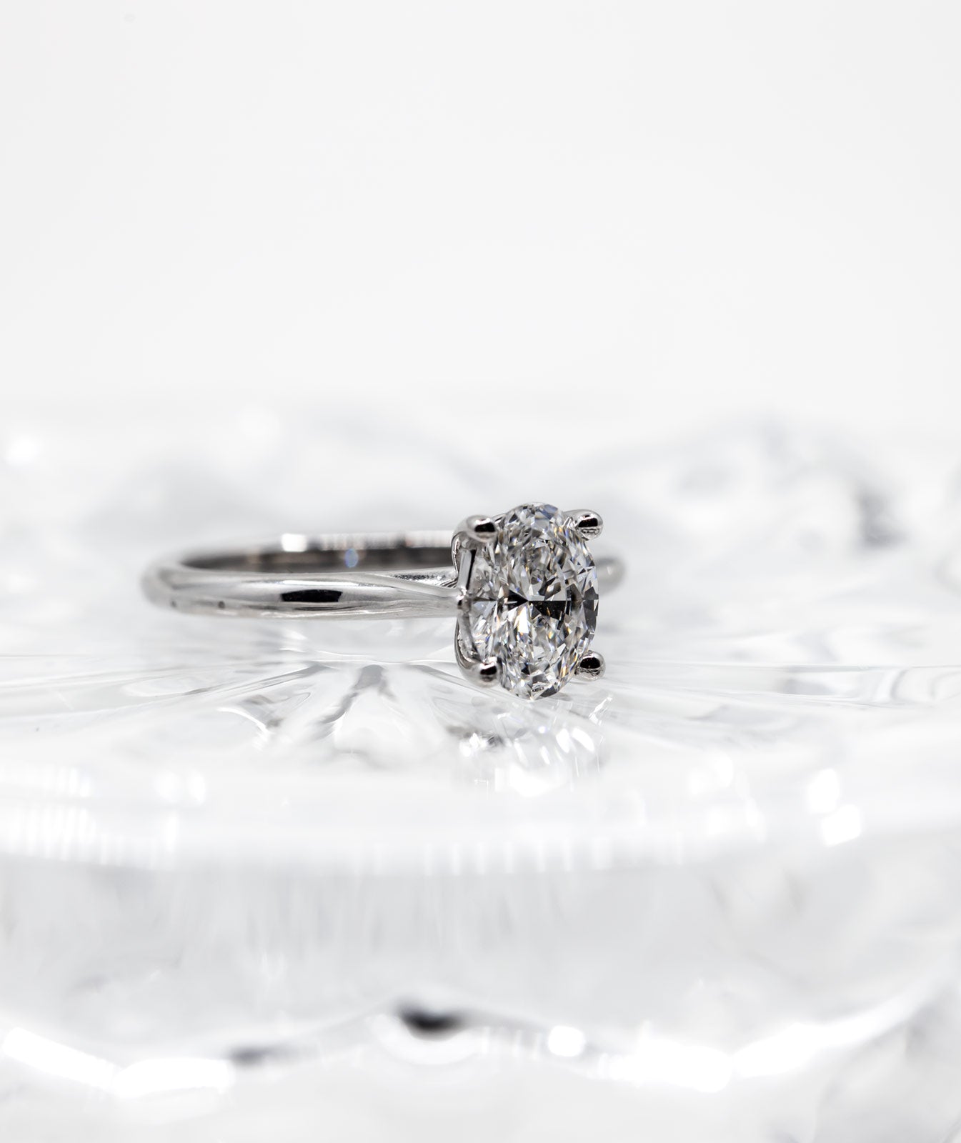 high-quality-diamond-ring-on-glass-vertical