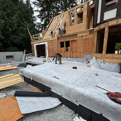 Finishing the installation of SUPERSEAL Double Drain with SUPERSEAL Waterproofing Tape over SUPERSEAL Waterproofing