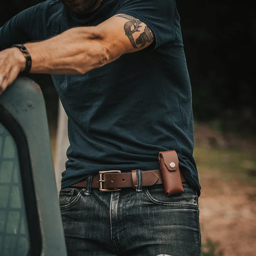 man wearing leather belt with Gerber Sheath