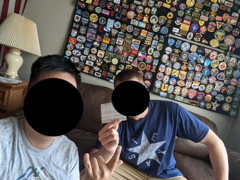 Chau with a patch collecting friend and his wall patches