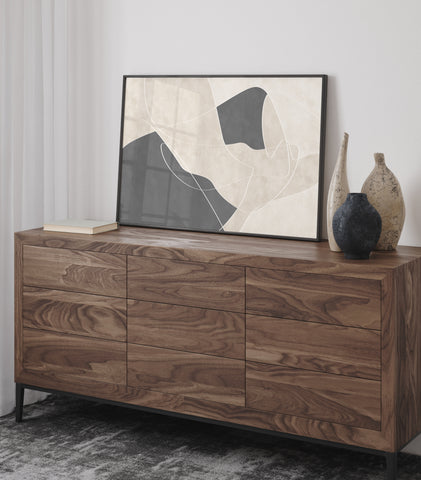 Black, white and neutral abstract wall art pictured in a wooden and neutral bedroom. 