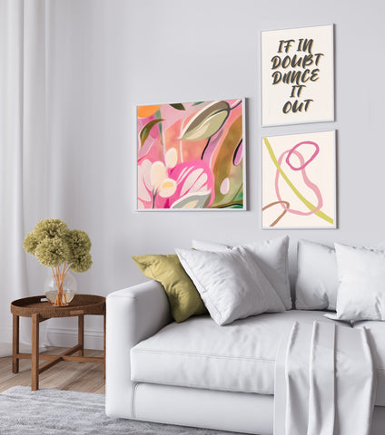 Mix of colourful framed prints to create a stylish gallery wall in grey and wood living room. 