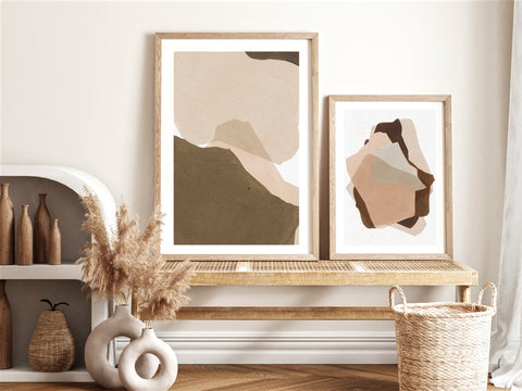 Neutral toned abstract wall art with wooden frame  in a neutral and wood living are. 