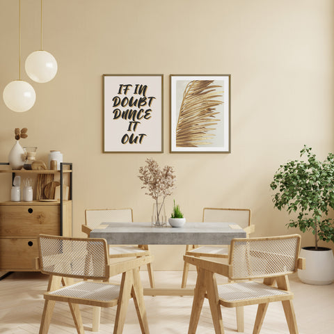 graphic wall art displayed in a gold toned and neutral dining room. 