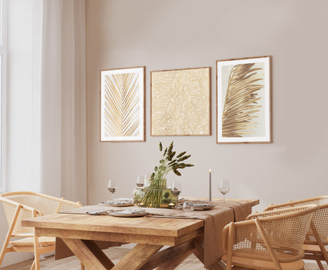 Set of 3 Gallery wall in gold pictured in a neutral and wooden dining room. 