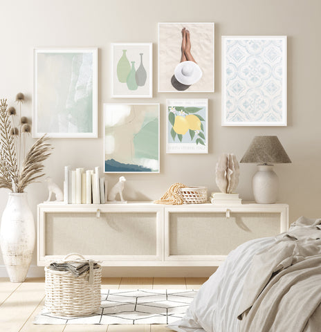 Green, Lemon and neutral summery gallery wall pictured in a neutral bedroom. 