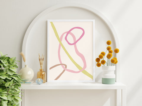 Colourful line abstract wall art with pink, green and neutral tones in a neutral living space. 