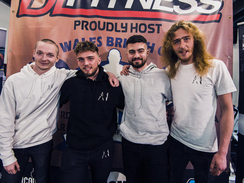 Animal Instinct power lifter after qualifying from the british championship posing for a picture with 3 owners of AI showing 3 Hoodies a t shirt and joggers