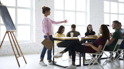 A seminar in a white room