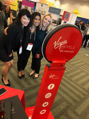 3 women taking a selfie at a trade show