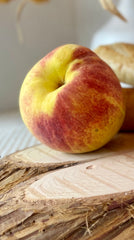 peach on wood slice tray