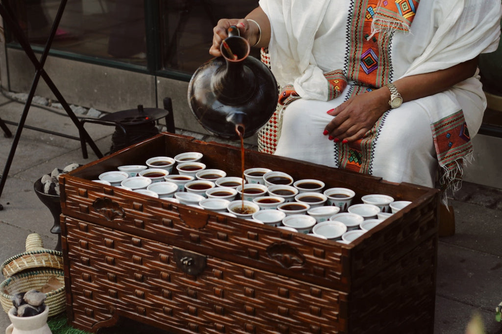 Ethiopian coffee being poured into small cups