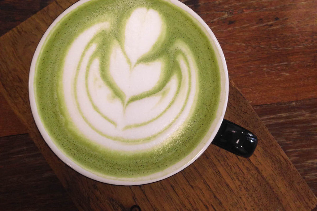 A matcha latte with beautiful latte art