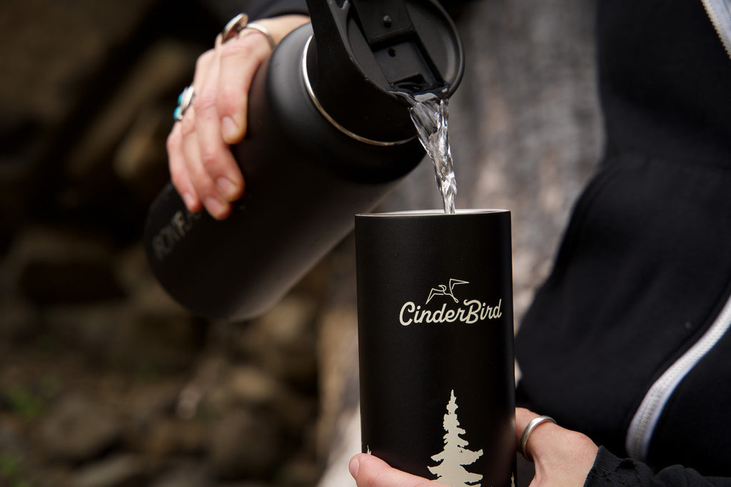 Pouring hot water into a travel thermos