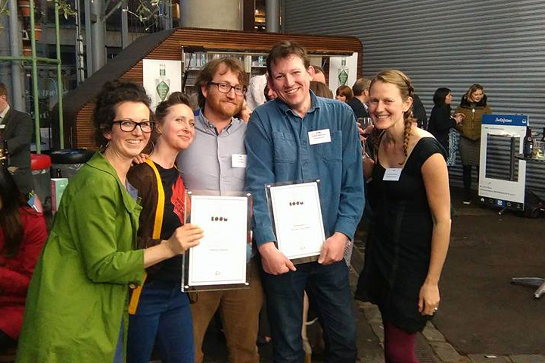 Josiah and Joe with our BOOM Award and friends from Unicorn Grocery